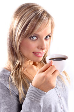 Beautiful woman holding a cup of coffee