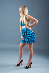 Naklejka premium Attractive girl in blue dress,
