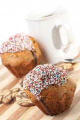 Tasty muffins with cup of tea