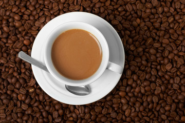 Cup with coffee, costing on coffee grain