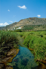 Fototapeta na wymiar Creek running through mountain fields in Crete, Greece