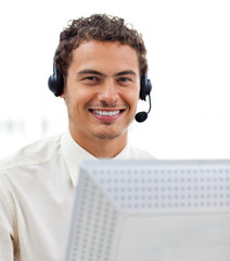 Latin young businessman with headset on