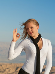 The young blonde in white blouse and black scarf