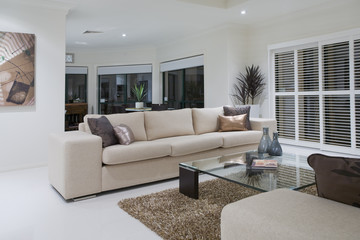 Luxurious living room with dining table in the background