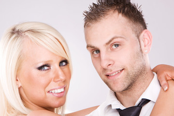 Young love couple smiling. Over white background