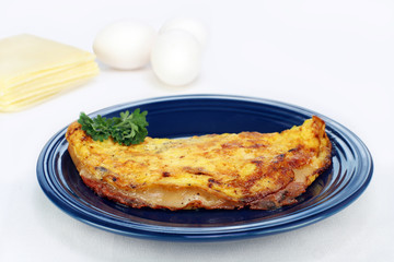 Omelet of ham and cheese with copy space.