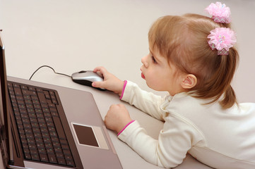 Little girl with laptop.