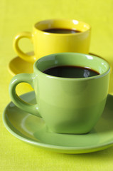 Yellow and green cups of coffee