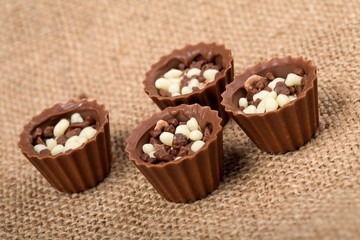 Chocolate candies with crumbs of dark and white chocolate