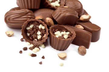 Assorted chocolate candies and nuts isolated