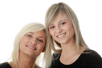 Happy young women friends laughing.