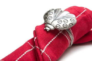 Napkin with a ring in the form of a ladybug.