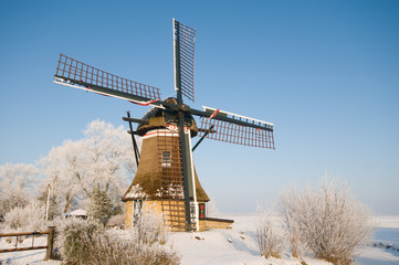 A mill in a winter landscape