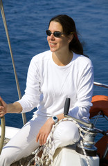 Young woman on a sailing yacht