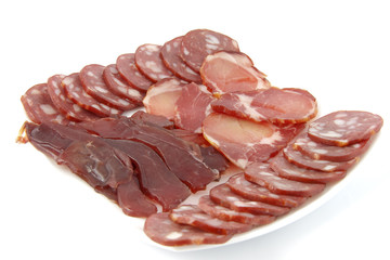 Cutting sausage and cured meat isolated on white background