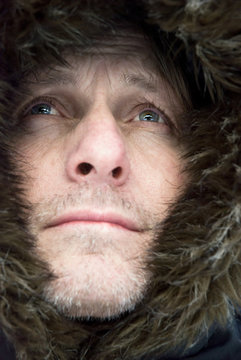 Mature Man Wearing Hooded Winter Coat