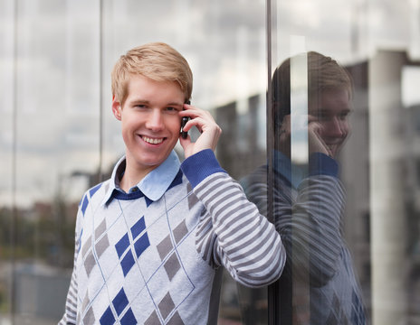 Happy young man with cellphone