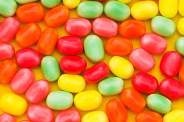 Various dry colourful sweets arranged as background