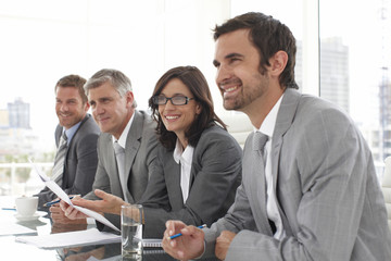 Businesspeople listening to a candidate
