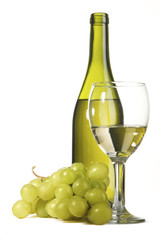 Bottle of white wine and grapes
