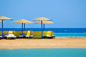 Straw umbrellas on the beach of Egypt
