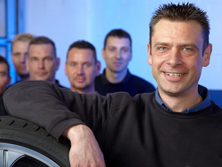 Tyre master mechanic in front of his assembly mans