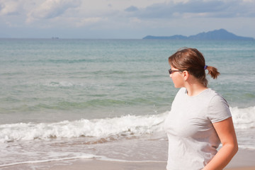 Fototapeta na wymiar Woman at the beach