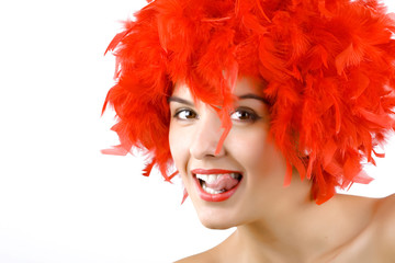 girl in red feathers with tongue ring exposed