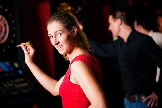 Group Of Friends Playing Darts