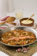 Spanish cuisine. Seafood spaghetti casserole. Fideua.