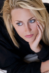 Beautiful But Sad Young Blond Woman With Blue Eyes