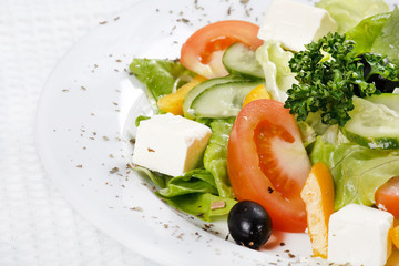 Caesar salad in a white plate.