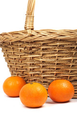 Tangerines and weaved basket.