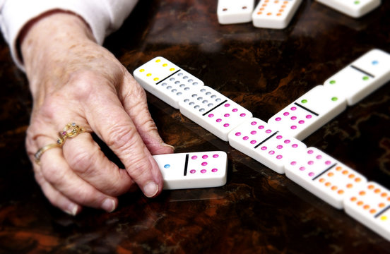 Woman playing dominoes