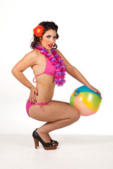 Young woman posing with beach ball