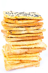 Stack of crunchy bread  with sesame on top