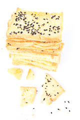Stack of crunchy bread  with sesame on top