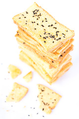 Stack of crunchy bread  with sesame on top