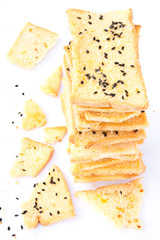 Stack of crunchy bread  with sesame on top