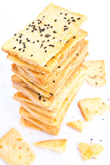 Stack of crunchy bread  with sesame on top