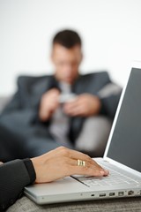 Hand typing on laptop