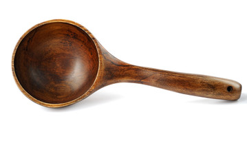 Big dark wooden spoon for cooking on white background
