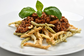 home made pasta with mince sauce and basil