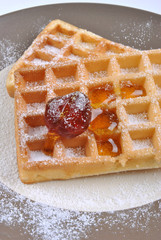 wafer with icing sugar and one cherry