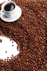 Cup with coffee, costing on coffee grain