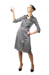 Cheerful businesswoman point a finger at something