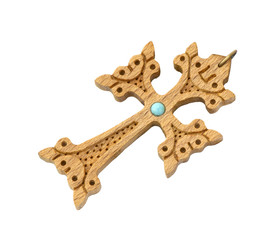 old cross of carved wood decorated with turquoise bead