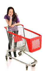 Unhappy girl with shopping cart