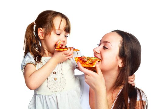 mother and daughter eating pizza