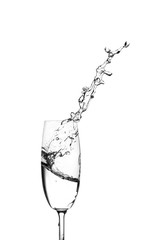 Water splashing out of a champagne glass